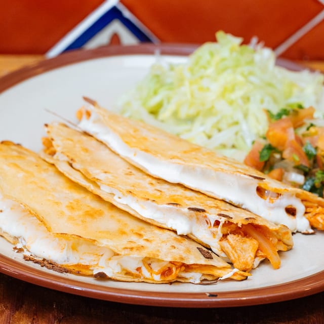 Tinga de Pollo (Shredded Spicy Chicken Breast) Quesadilla.